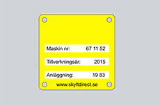 Liten, gul maskinskylt