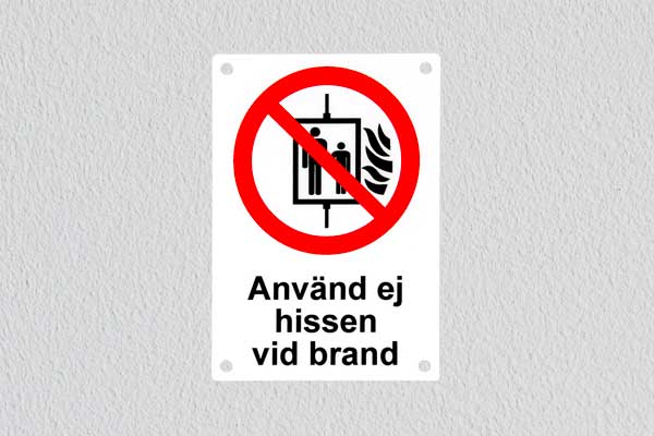 Förbudsskylt, använd ej hiss vid brand