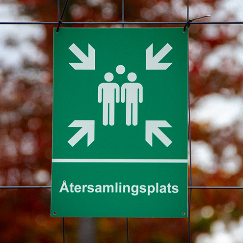 Skylt som visar återsamlingsplats